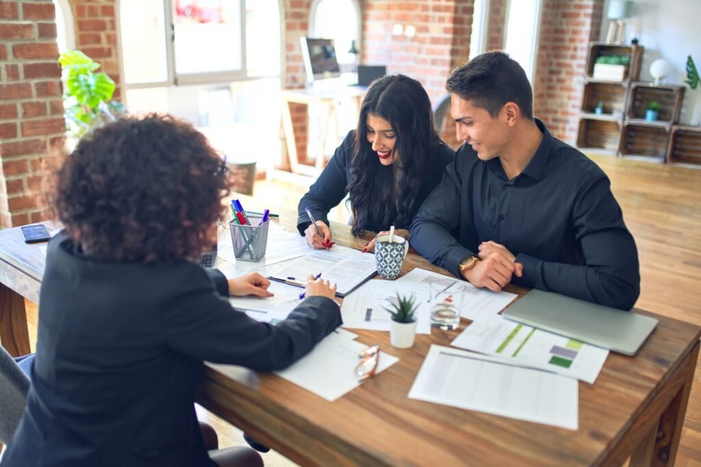 Clients signing mortgage paper